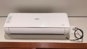 a white printer sitting on top of a table at LOFT 02 · Loft127-02 Compacto, equipado, ótima localização in Itajaí +23 photos