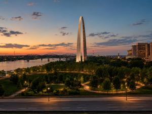 a view of the obelisk at night with a bridge at Brick & Bed Riverfront Lofts, T 308 in Saint Louis