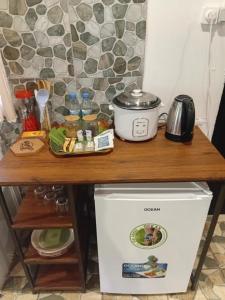 a wooden counter top on top of a refrigerator at Tereva home 2 in Bora Bora +7 photos