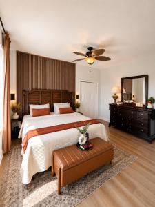 a bedroom with a large bed and a ceiling fan at Golden Hour Penthouse - TideWater Beach Resort 2700 in Panama City Beach +21 photos