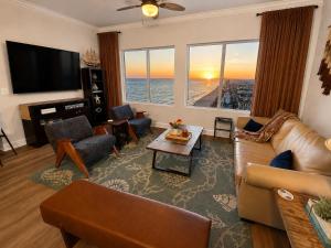 a living room with a view of the ocean at Golden Hour Penthouse - TideWater Beach Resort 2700 in Panama City Beach