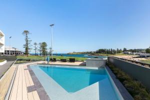 a swimming pool on the side of a building at Kove Apartment - G03 in Kiama