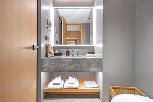 a bathroom with a sink and a mirror at 上海天平宾馆 in Shanghai