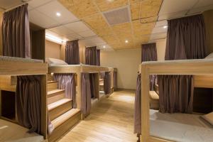 Postel nebo postele na pokoji v ubytování Hostel Jiizu