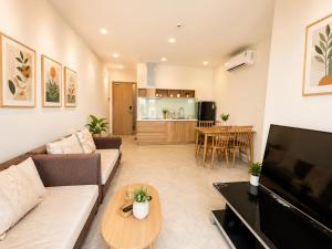 a living room with a couch and a table at Jess Apt in Tuy Hoa