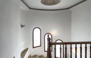 a staircase in a house with a window and a ceiling at Taurus 13 in Jun
