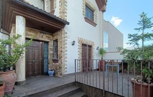 a porch of a house with a wooden door at Taurus 13 in Jun +17 photos