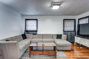 a living room with a couch and a coffee table at Centralized Modern Home in Johnson City in Johnson City