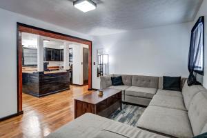 a living room with a couch and a table at Centralized Modern Home in Johnson City in Johnson City