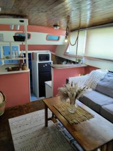 a living room with a bed and a table at party like a local in Key West