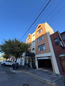 a building with a car parked in front of it at city unit at gouger st in Adelaide