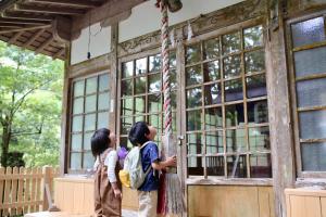 two girls standing in front of a building at SEN RETREAT TAKIJIRI - Kumano Kodo Gateway in Tanabe