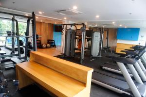 a gym with several treadmills and machines at Wyndale Hotel in Camalig
