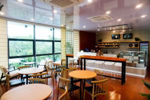 a restaurant with tables and chairs and a counter at Wyndale Hotel in Camalig +32 photos