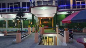 a building with a pool in front of it at Hotel Shubh Yatra in Nandaprayāg