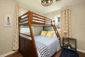 a bedroom with a bunk bed with a bed sqor at Lakefront - Grill - Bunk Beds - Sleeps 6 in Akron