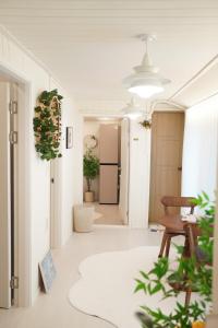 a living room with a table and a hallway at Yeosu1944 in Yŏsu +87 photos
