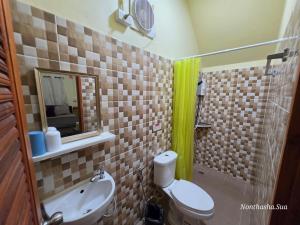 a bathroom with a toilet and a sink and a shower at Bunrapee House in Nan +39 photos