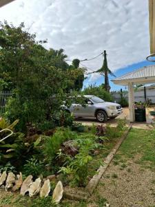 a car parked in the driveway of a house at Talipaea Lodge in Nuku‘alofa