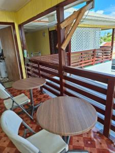 a table and chairs on the balcony of a restaurant at Talipaea Lodge in Nuku‘alofa