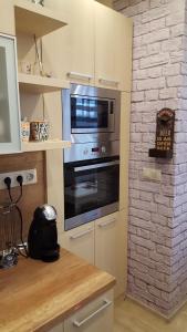 A kitchen or kitchenette at Take your time Apartment