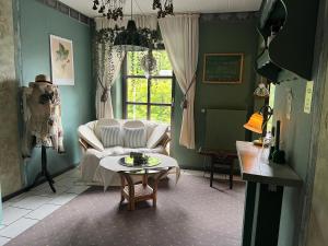 a living room with a couch and a table at Appartement 9 Nichtraucherappartement in Coesfeld +2 photos