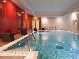 a hotel room with a large swimming pool at Novotel Liverpool Centre in Liverpool