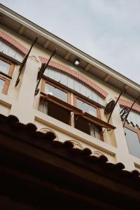 two butterflies on the side of a building at Spiegel Home Studio in Semarang