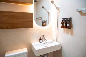 a bathroom with a sink and a mirror at 가치스테이 강서 in Seoul