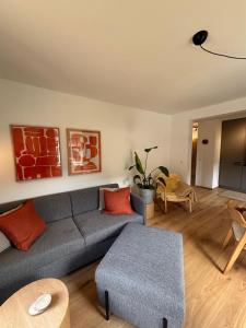 a living room with a couch and a table at Alpensegler in Mittenwald