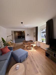 a living room with a couch and a table at Alpensegler in Mittenwald