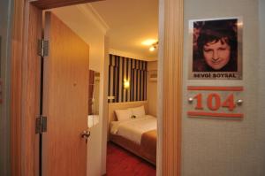Postel nebo postele na pokoji v ubytování Mini Hotel