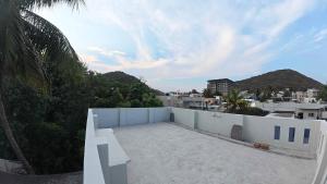 a view of a rooftop of a white building at Deodar Commune in Visakhapatnam