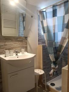 a bathroom with a sink and a shower at Liberty 21 in Andria