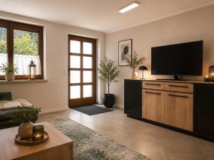 a living room with a flat screen tv at Ferienhaus 147 in Sekull