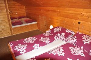 Letto o letti in una camera di Holzhaus in Hinterstoder