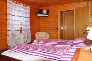 Letto o letti in una camera di Holzhaus in Hinterstoder