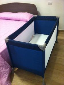 A bed or beds in a room at Tempo Di Sole con Serv Spiaggia