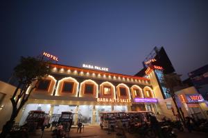 a building with a sign for a bar and cafe at Baba Palace in Ayodhya