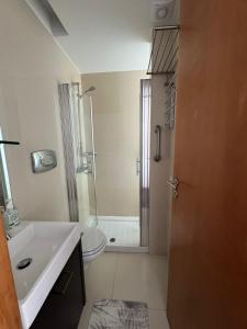 a bathroom with a sink and a toilet and a shower at Beach House - Aguda Beach - 2 bedrooms in Arcozelo +9 photos