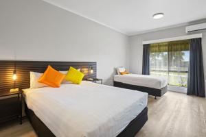 a hotel room with two beds and a window at Carrum Downs Motel in Carrum Downs +34 photos