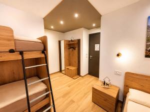 a dorm room with bunk beds and a hallway at Sweet Alps in Tirano