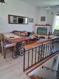 a living room with a table and a couch at Maria Apostolou villa in Almiros