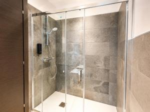 a shower with a glass door in a bathroom at Sweet Alps in Tirano +13 photos
