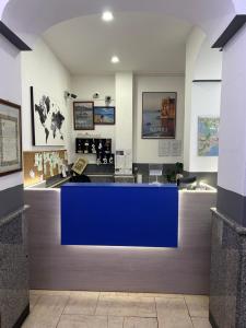 a restaurant with a blue counter in a room at Hotel cappuccetto rosso in Lusciano