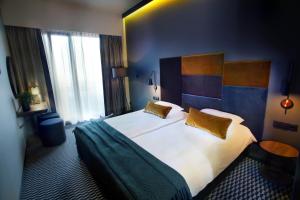 Łóżko lub łóżka w pokoju w obiekcie Hotel Remes