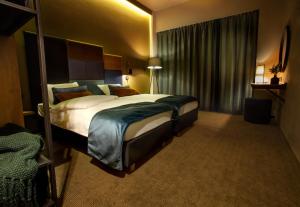 Łóżko lub łóżka w pokoju w obiekcie Hotel Remes