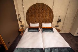 Łóżko lub łóżka w pokoju w obiekcie Hotel Remes