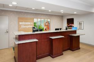 a lobby with a welcome to hamiami sign on the wall at Hampton Inn and Suites Alexandria in Alexandria +49 photos