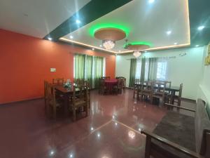 an empty dining room with tables and chairs at Hotel Swagat Sarovar in Pauri